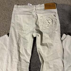 RED Valentino White Corduroy Flare Jeans with Floral Pocket Embroidery